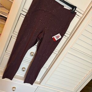 NWT- Reebok Plum colored- chic patterened leggings.